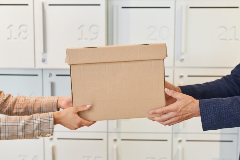 Business People Handing Box